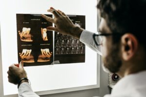 dentist analyzing x-rays